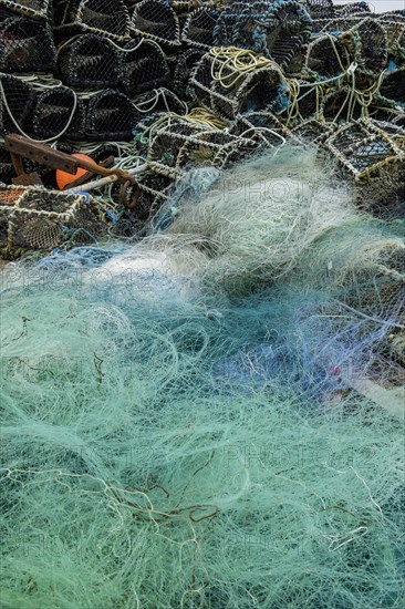 Turquoise fishing net and lobster baskets