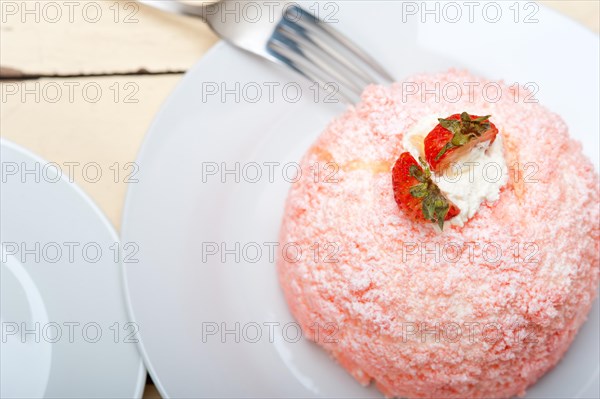 Fresh pink strawberry and whipped cream dessert macro close up