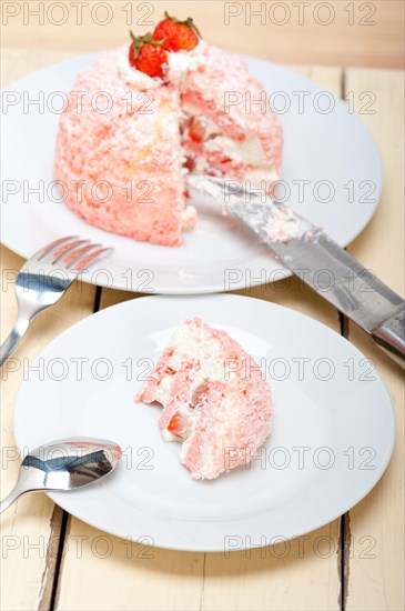 Fresh pink strawberry and whipped cream dessert macro close up