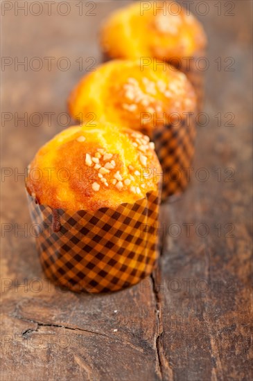 Fresh baked muffin on old wood table