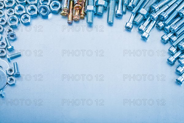 Metallic background with stack of metal tools with thread design concept