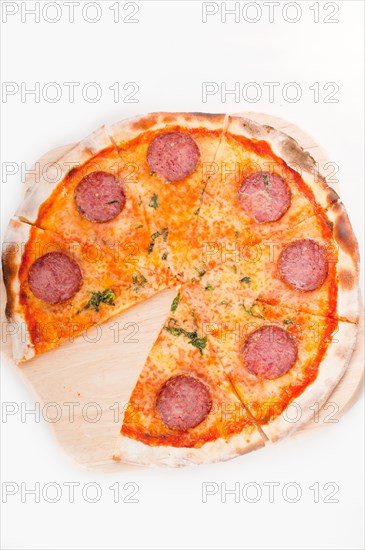 Italian original thin crust pepperoni pizza isolated on white