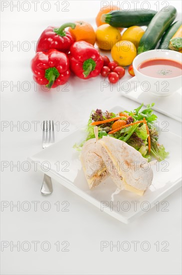 Tuna fish and cheese sandwich with fresh mixed salad