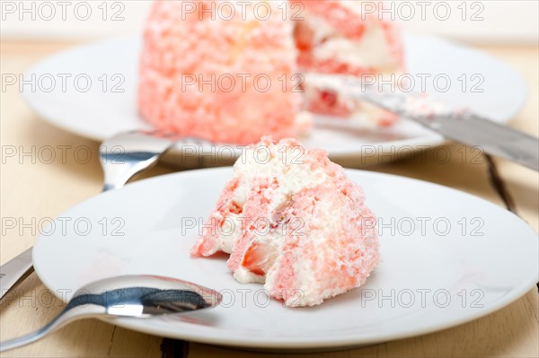 Fresh pink strawberry and whipped cream dessert macro close up