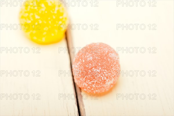 Sugar jelly fruit candy over white wood table