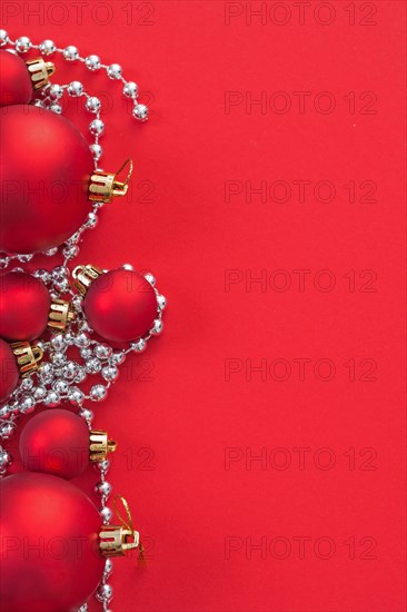 Copyspace image Christmas baubles on a red background