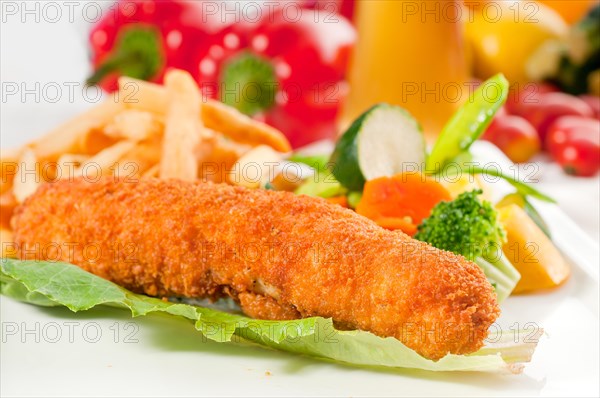 Fresh breaded chicken breast roll and vegetables