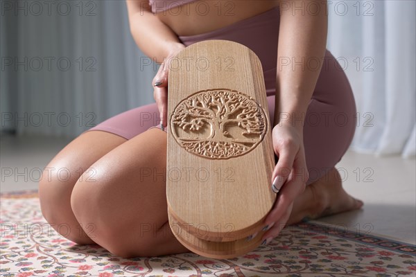 Image of a Sadhu board in female hands. Yoga concept. Spiritual practices. Mixed media