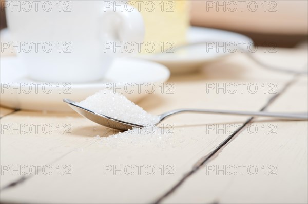 Italian espresso coffee and cheese cake over white wood table