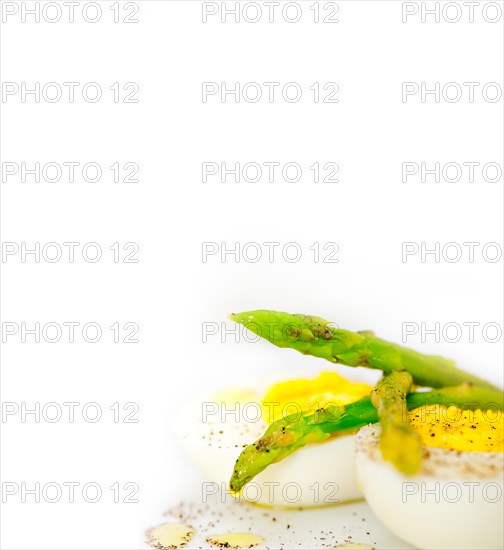 Boiled fresh green asparagus and eggs with extra virgin olive oil