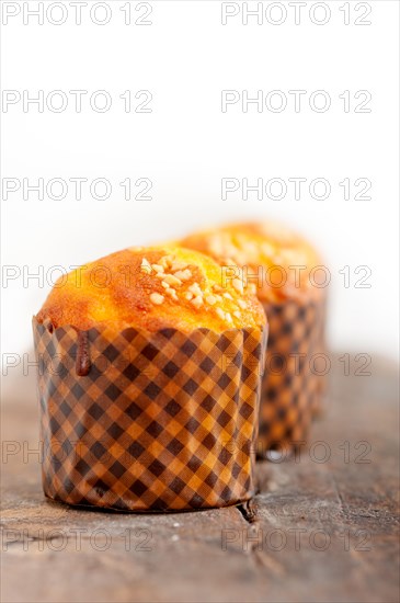 Fresh baked muffin on old wood table