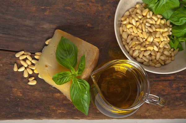 Italian basil pesto ingredients over old wood macro