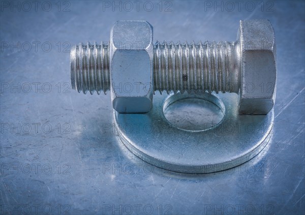 Bolt washers screwbolts construction nuts on metallic background maintenance concept