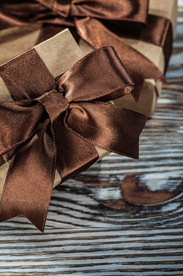 Composition of brown gift boxes on wooden background