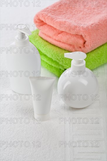 Accessories for bathing on a white towel