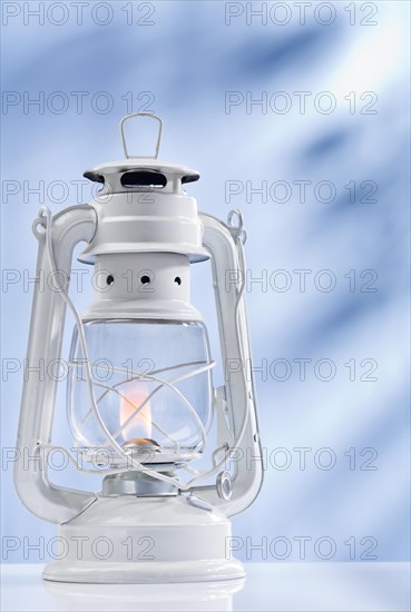 Paraffin lamp on a blue background