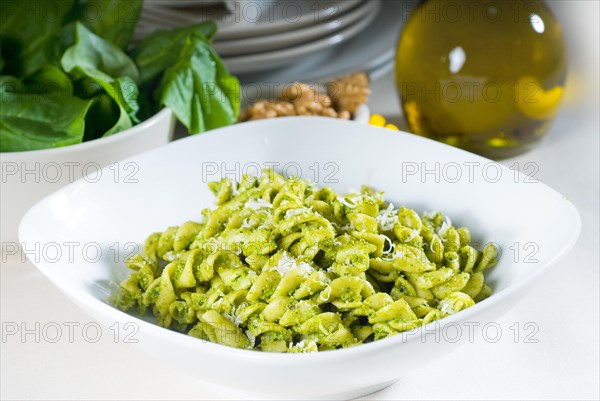 Italian fusilli pasta and fresh homemade pesto sauce