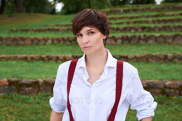 Image of a stylish beautiful woman in a white shirt