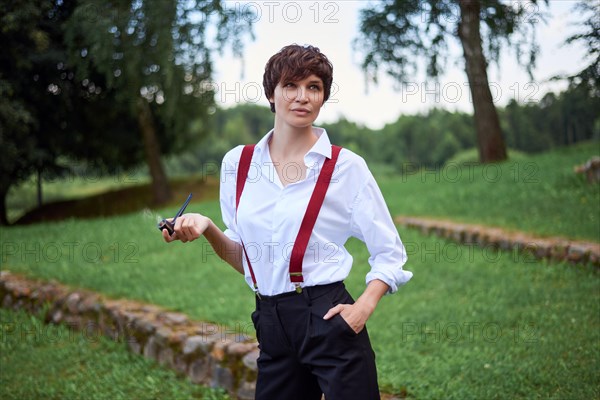 Image of a stylish beautiful woman in a white shirt