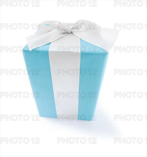 Classic blue gift box with a white bow against a white background