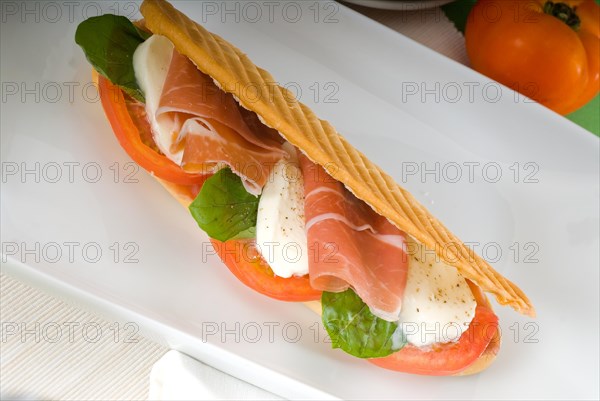 Panini sandwich with fresh caprese and parma ham