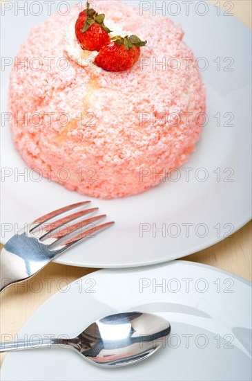 Fresh pink strawberry and whipped cream dessert macro close up