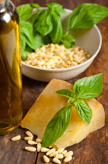 Italian basil pesto ingredients over old wood macro