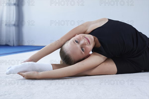 Image of a little girl in the gym. Gymnastics concept. Mixed media