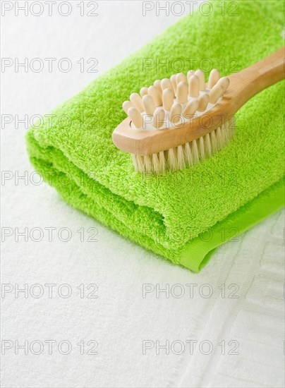 Brush on green towel