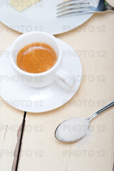 Italian espresso coffee over white wood table