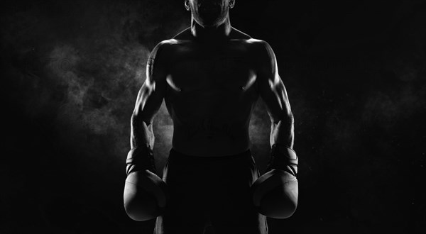 Noname image of a kickboxer on a dark background. The concept of mixed martial arts. MMA