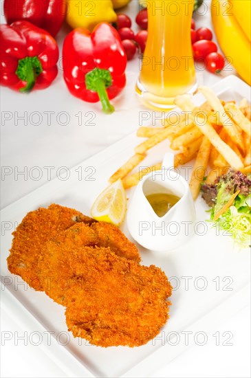 Classic breaded Milanese veal cutlets with french fries