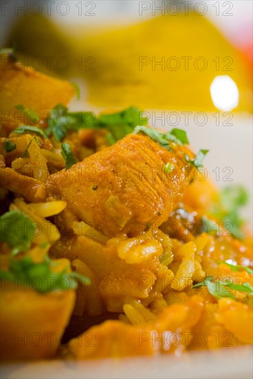 Fresh home made curry beef rice and potatoes with ingredients around composition