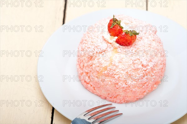 Fresh pink strawberry and whipped cream dessert macro close up