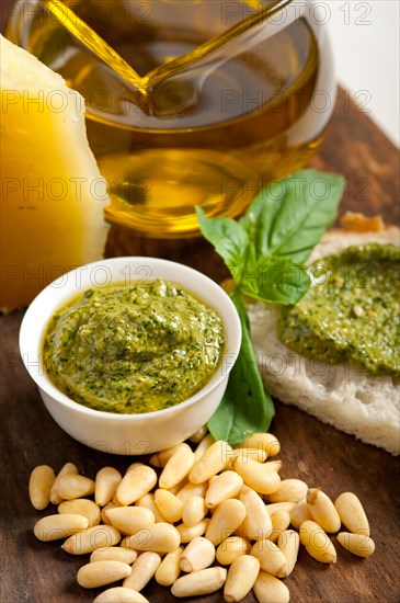 Italian basil pesto bruschetta ingredients over old wood macro