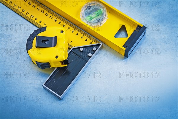 Yellow measuring instruments on a metallic background Maintenance concept
