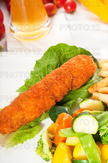 Fresh breaded chicken breast roll and vegetables