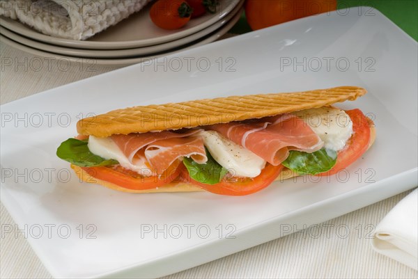 Panini sandwich with fresh caprese and parma ham