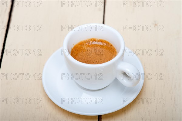 Italian espresso coffee over white wood table