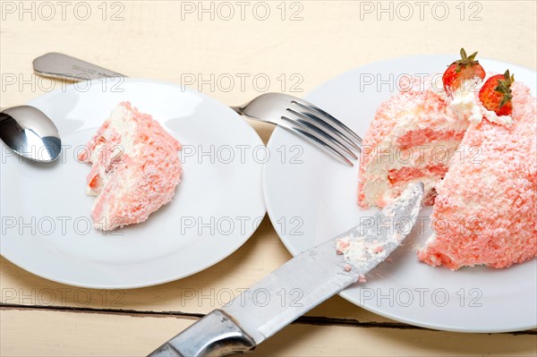 Fresh pink strawberry and whipped cream dessert macro close up