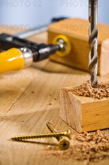 Drilling a hole in a wooden plank