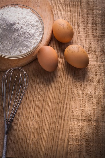 Eggs Cauliflower flour in a bowl on a wooden board