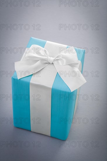 Blue giftbox on gray background
