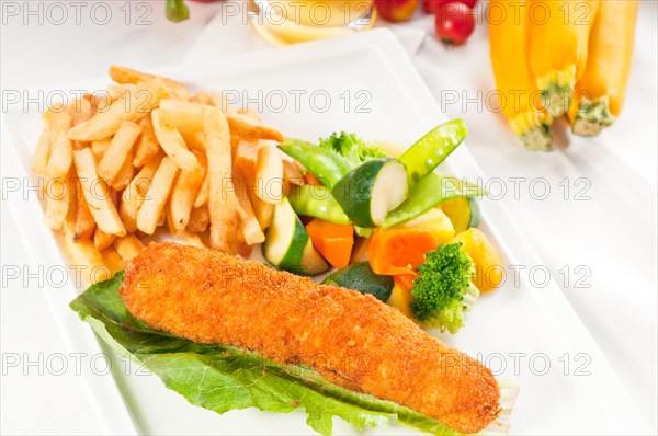 Fresh breaded chicken breast roll and vegetables