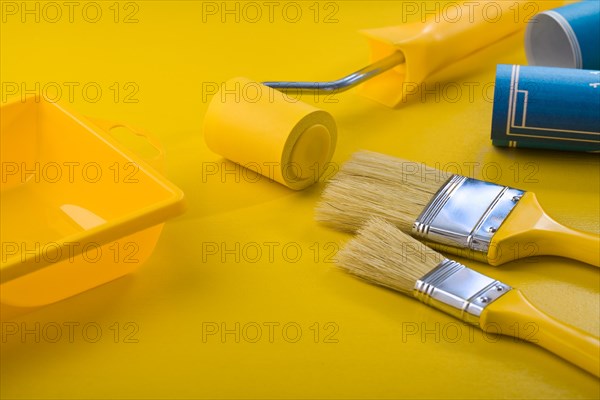 Painting utensils on a yellow table