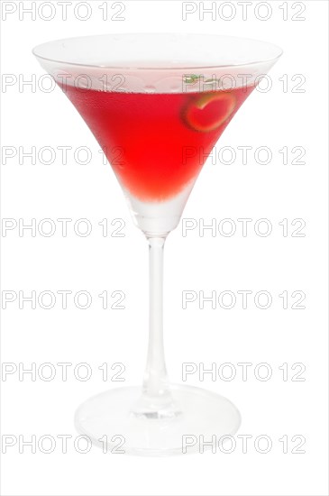 Cosmopolitan drink cocktail straight up on martini cup with lime peel isolated on white background