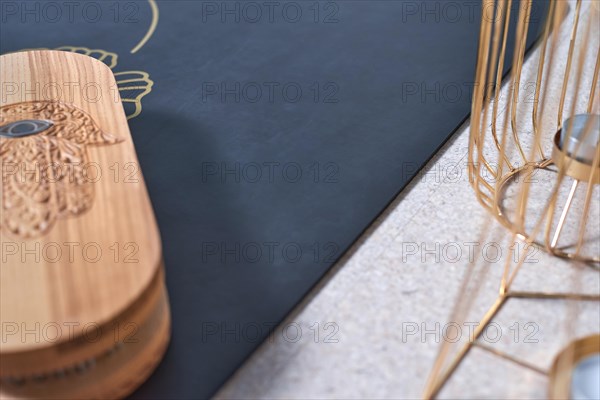 Image of a box with nails in a light studio on a black mat. Yoga concept. Spiritual practices. Mixed media