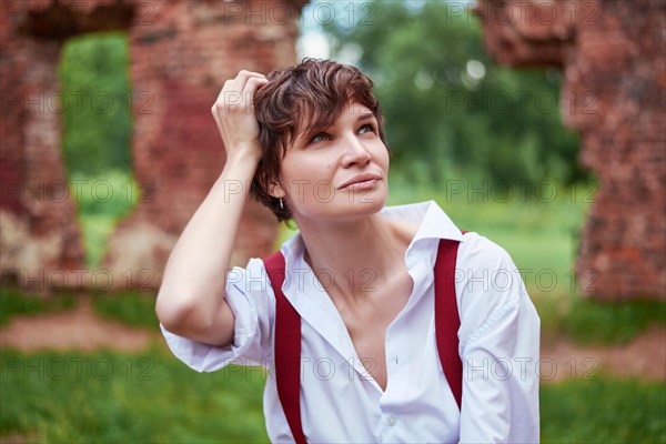 Image of a stylish beautiful woman in a white shirt