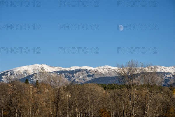 Natural landscape in the autumn with snow-capped mountains in the Cerdanya area in the province of Gerona in Catalonia in Spain