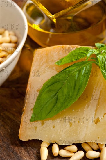 Italian basil pesto ingredients over old wood macro